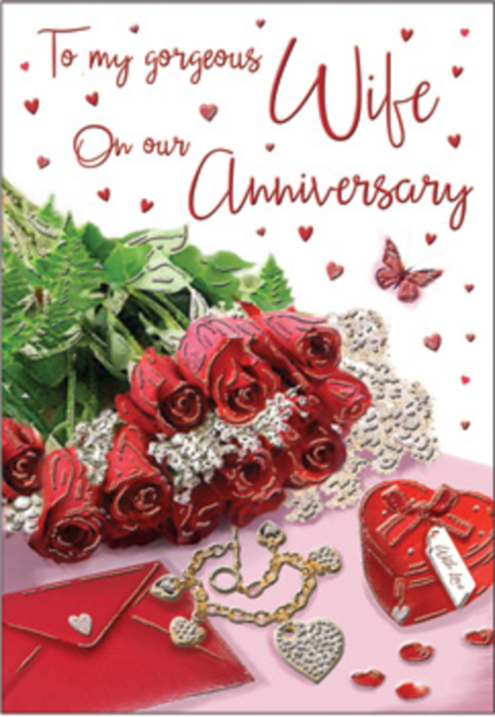 This anniversary card presents a rich, romantic scene, as though a cherished arrangement has been laid out on a polished surface in a Morden living room just before an evening celebration. At its centre, a bouquet of timeless red roses takes pride of place, each bloom fully open and luxuriously rounded, the petals layered so densely that they form soft, sculptural curls. The roses are wrapped in a halo of lush greenery, the leaves and stems interlacing to create a sense of natural abundance, like an expertly tied bouquet picked up from Morden Florist on the way home through familiar local streets. Delicate touches of lace and heart-shaped motifs appear nearby, their patterns light and airy against the deeper reds and greens. A refined jewellery set rests alongside a vivid red box, perhaps a gift to be exchanged later, their metallic gleam and velvet textures hinting at the weight of shared memories and meaningful milestones. The card's scripted message-flowing and graceful-winds through the composition, echoing the gentle curves of the floral stems and the jewellery chain. Soft, even lighting bathes the entire arrangement, reducing harsh contrasts and imparting a warm glow that suggests a cosy interior on a cool evening. Everything in the scene, from the richness of the roses to the subtle shimmer of gold and silk, combines to create an atmosphere of deep affection and gratitude. It feels like a visual reflection of years spent side by side in Morden, celebrating both grand occasions and quiet, everyday moments.